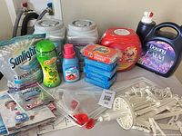 Overview of all detergent containers, softeners, Tide boxes, clip hanger, sweater rack