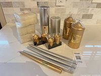 Overview of all candle types and quantities on countertop