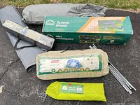 Group view showing all four packed shelter items and metal poles