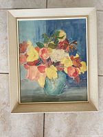 Overall view of framed floral watercolor painting under glass