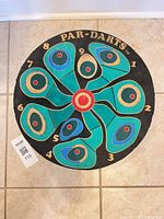 Full view of Par-Darts dartboard face showing colors and wear