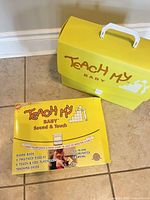 Closed yellow Teach My Baby carrying case with kit sleeve