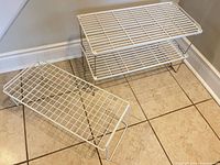 Two assembled risers stacked plus one single riser on floor