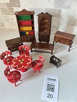 All ten wooden dollhouse furniture pieces arranged together
