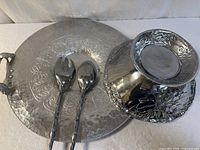 Group shot of bowl, platter, and two utensils