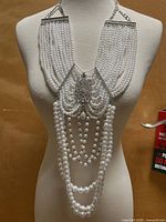 Full view of layered faux pearl choker on mannequin