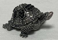 Front side view of jeweled turtle trinket box