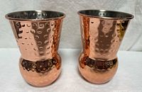Front view of both hammered copper tumblers