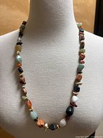 Necklace displayed on bust form