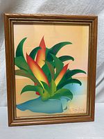 Full view of framed tropical plant artwork