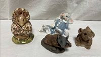 Group view of all four animal figurines