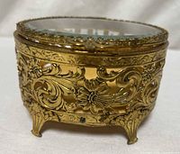 Front angle showing brass filigree and feet