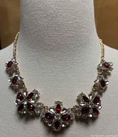 Full view of necklace on bust showing overall design and condition