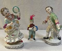 Full view of all three porcelain figurines