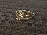 Top view of 10k gold ring showing abstract textured design
