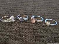 All four sterling silver heart rings on display