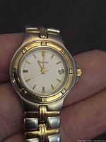 Front view of Bulova ladies wristwatch showing dial, bezel, and bracelet detail