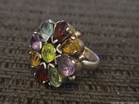 Top view showing nine gemstones in floral cluster