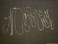 Full view of all sterling silver jewelry pieces laid out on dark fabric