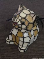 Front three-quarter view of stained glass cat lamp