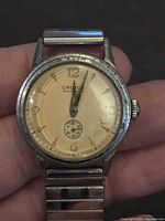 Front view showing dial, hands, numerals, sub-seconds and overall face condition