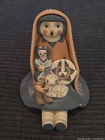 Full view of storyteller figurine showing front details