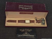 Watch in presentation box with tag and booklet