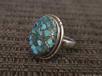 Front view of ring showing turquoise cabochon and silver bezel