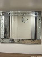 Front view of large Venetian mirror mounted on wall