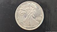 Obverse of 1/10 oz silver round showing Walking Liberty design