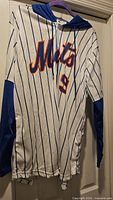 Front view of white pinstripe Mets hooded jersey with script logo