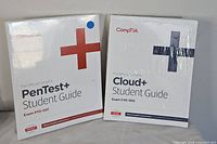 Front covers of both sealed CompTIA student guides