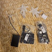 Three light sets, two sealed, one open; two star covers visible