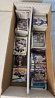Long cardboard box filled with sports trading cards