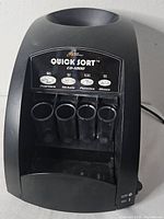 Front view showing overall coin sorter and coin tubes