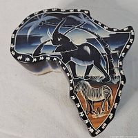 Top view showing Africa shape and painted elephant and zebra artwork