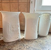 Three AK Kaiser bisque porcelain vases front view