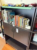 Front view of bookcase with contents shown (not included)
