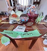Overall lot view on table showing tray table and decorative items