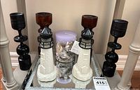 overall view of tray with candle holders, candle and lighthouse bottles