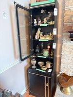 Full view of cabinet with door open showing display shelves and lower compartment