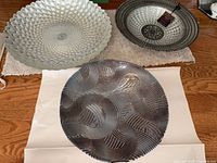 Overview of all three decorative bowls on table