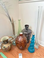 Group shot of all vases and pitcher
