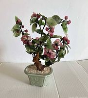 Full view of jade glass bonsai tree in celadon pot