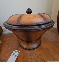 Front view of decorative lidded bowl showing pedestal base and domed lid