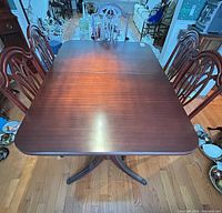 Top view of dining table with chairs visible