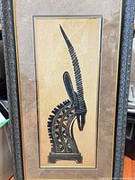 Full view of framed textile art