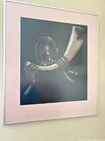 Framed pastel portrait on black background, pink mat