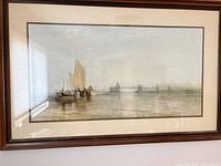 Full view of framed print showing sailboat scene and wooden frame