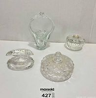 Group shot of four glass and crystal pieces